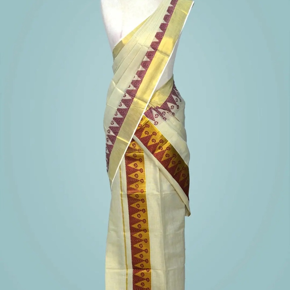 Elegant Cream and Gold Saree with Red Accents